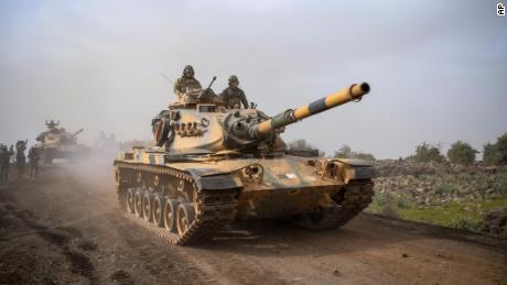 Turkish army tanks enter Afrin, an enclave in northern Syria controlled by U.S.-allied Kurdish fighters, in Hassa, Hatay, Turkey, Monday, Jan. 22, 2018. Turkey's President Recep Tayyip Erdogan has said his country will "not take a step back" from its military operation on Afrin. Speaking in Ankara on Monday_the third day of the operation— Erdogan said Turkey's "fundamental goal" is ensuring national security, preserving Syria's territorial integrity and protecting the Syrian people.(AP Photo)