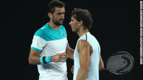 Rafael Nadal and Marin Cilic exchange a handshake. 