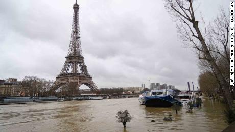 Record rainfall has caused the banks of the Seine river in Paris to overflow, flooding surrounding streets and causing travel disruptions. 