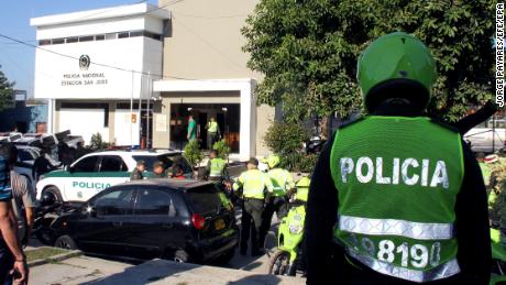 Officers are on the scene at the Barranquilla, Colombia, station house after Saturday&#39;s bombing.   