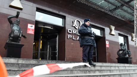 A Russian police officer stands outside Alexei Navalny's Moscow office on Sunday.