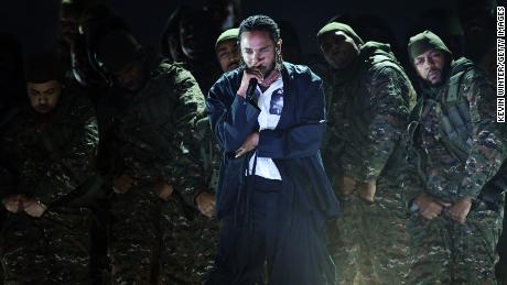 NEW YORK, NY - JANUARY 28:  Recording artist Kendrick Lamar (C) performs onstage during the 60th Annual GRAMMY Awards at Madison Square Garden on January 28, 2018 in New York City.  (Photo by Kevin Winter/Getty Images for NARAS)