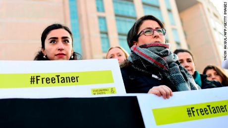 A group of human rights activists gather outside an Istanbul courthouse on Wednesday.