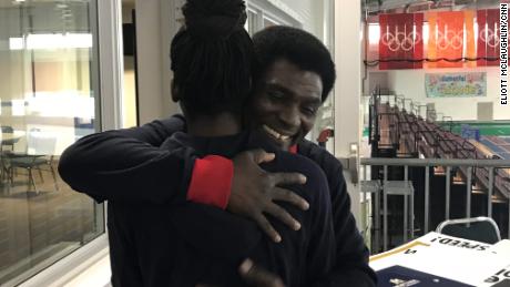 Kweku Biney embraces his daughter at the Utah Olympic Oval last month. 