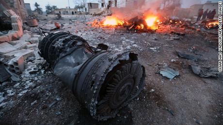 Smoke billows from the site of the downed Russian plane Saturday in the northwest province of Idlib.