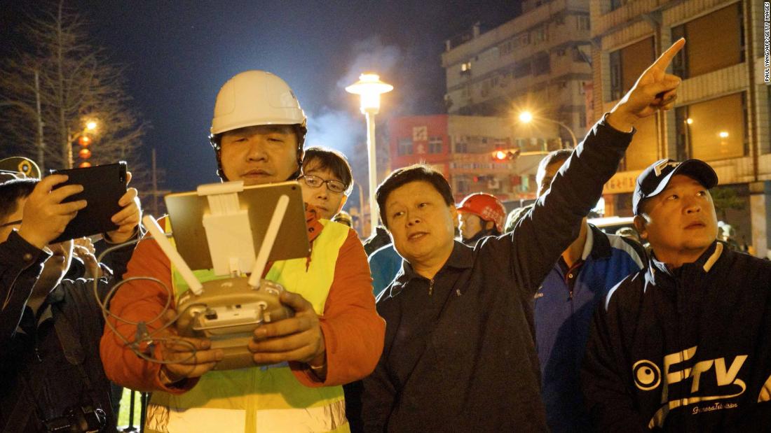 Rescue workers check the area affected by the quake in Hualien.
