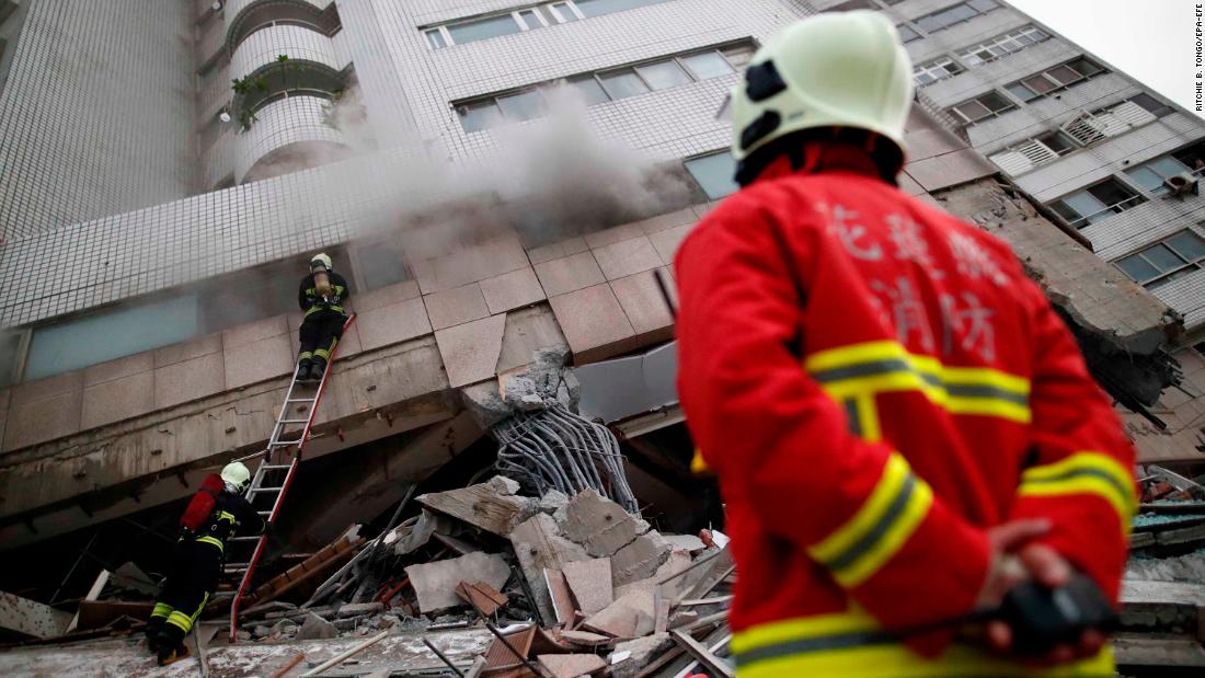 Rescuers search for survivors on February 7.