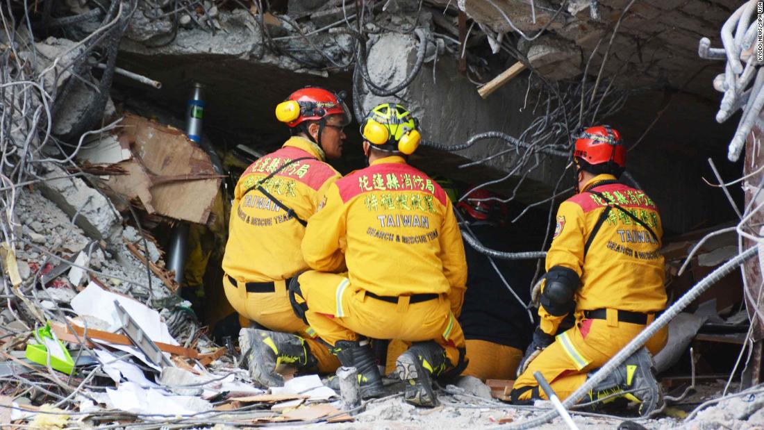 A crew searches for survivors believed to be trapped inside the collapsed Marshal Hotel in Hualien.