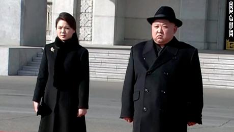  North Korean leader Kim Jong Un, right, and his wife Ri Sol Ju arrive at the parade