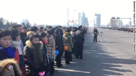 Bystanders wait for the parade to begin in Pyongyang, North Korea. 