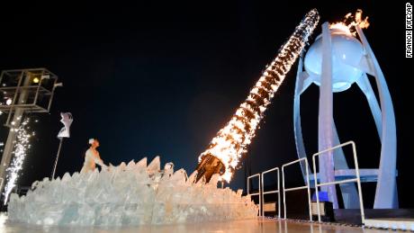 South Korean Olympic figure skating champion Yuna Kim lights the Olympic flame.