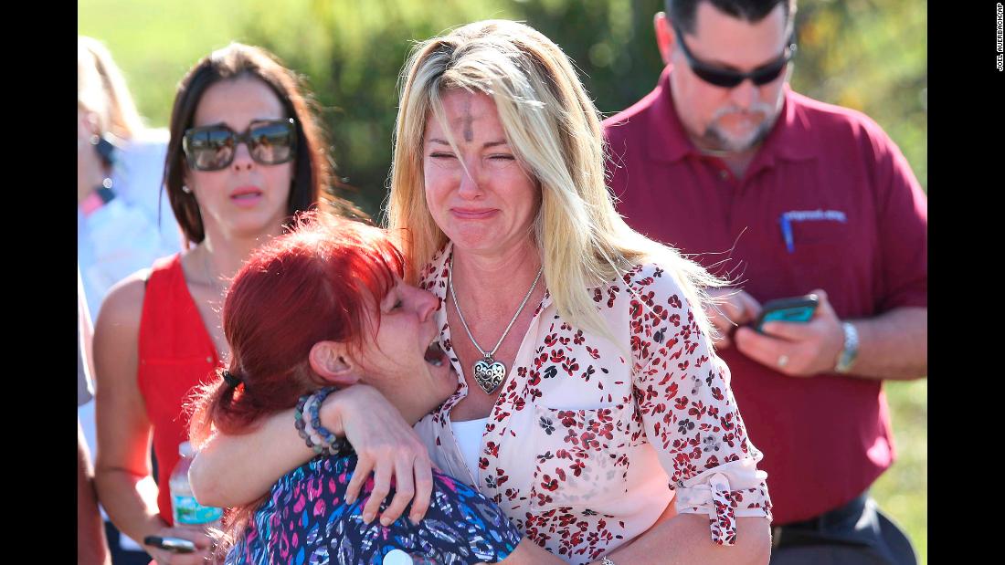 Parents wait for news after a shooting at Marjory Stoneman Douglas High School in Parkland, Florida, on Wednesday, February 14.&lt;a href=&quot;https://www.cnn.com/2018/02/14/us/florida-high-school-shooting/index.html&quot; target=&quot;_blank&quot;&gt; At least 17 people were killed at the school&lt;/a&gt;,  Broward County Sheriff Scott Israel said. The suspect, 19-year-old former student Nikolas Cruz, is in custody, the sheriff said. The sheriff said he was expelled for unspecified disciplinary reasons.