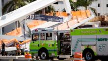 Emergency personnel work at the scene.