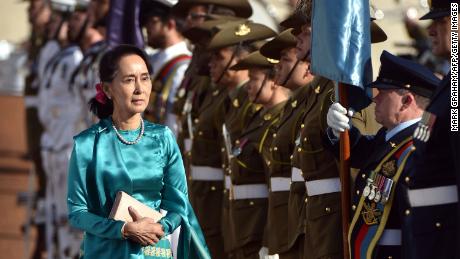 Myanmar&#39;s State Counsellor Aung San Suu Kyi, left, receives an official welcome on March 19, on the forecourt during her visit to Parliament House in Canberra, Australia.