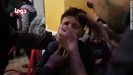 A screengrab from an activist video shows a child being treated by emergency responders.