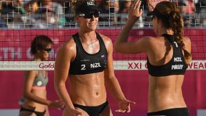 GOLD COAST, AUSTRALIA - APRIL 08:  Shaunna Polley #1 and Kelsie Wills #2 of New Zealand celebrate during the Beach Volleyball Women&#39;s Preliminary round against Ee Shan Lau and Wei Yu Ong of Singapore on day four of the Gold Coast 2018 Commonwealth Games at Coolangatta Beachfront on April 8, 2018 on the Gold Coast, Australia.  (Photo by Matt Roberts/Getty Images)