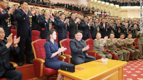 North Korean leader Kim Jong Un and his wife Ri Sol-Ju, seen in an undated handout image from North Korean state media, attending an art performance in Pyongyang. 