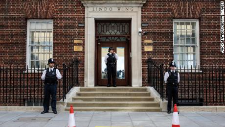 Police officers stand guard outside the Lindo Wing of St Mary&#39;s Hospital ahead of the birth.