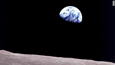 Apollo 8 astronaut Bill Anders took this breathtaking photo of the &quot;Earthrise&quot; over the moon&#39;s landscape. 