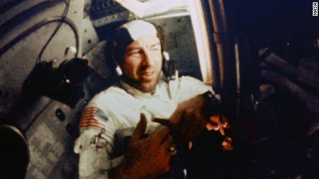 Navigator Jim Lovell works inside Apollo 8&#39;s cramped quarters. 