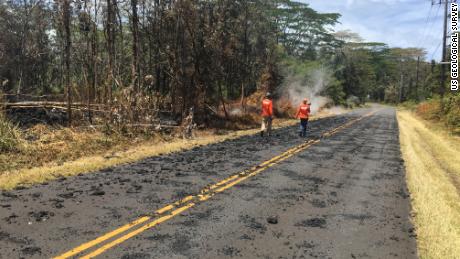 USGS scientists monitor the eruption in Leilani Estates Sunday.