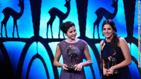Yusra and Sara Mardini are seen on stage at the 2016 Bambi Awards. Sara has gone back to the the scene of their plight in Lesbos, in order to help others making similar journeys.