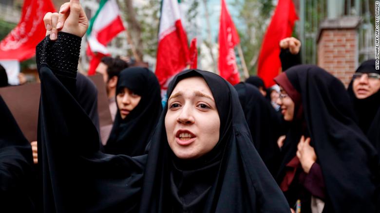 Iranian women chant slogans during an anti-US demonstration outside the former US embassy headquarters in the capital Tehran on May 9, 2018. - Iranians reacted with a mix of sadness, resignation and defiance on May 9 to US President Donald Trump&#39;s withdrawal from the nuclear deal, with sharp divisions among officials on how best to respond.
For many, Trump&#39;s decision on Tuesday to pull out of the landmark nuclear deal marked the final death knell for the hope created when it was signed in 2015 that Iran might finally escape decades of isolation and US hostility. (Photo by ATTA KENARE / AFP)        (Photo credit should read ATTA KENARE/AFP/Getty Images)