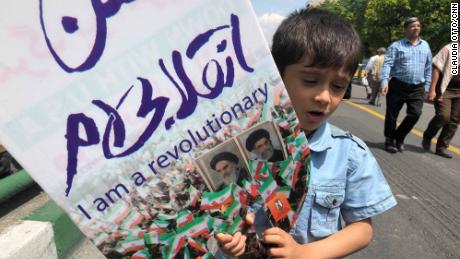 A young boy takes part in an demonstration in Tehran.