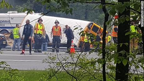 Emergency crews evaluate the scene of a school bus crash in Mount Olive Township, New Jersey, on May 17.