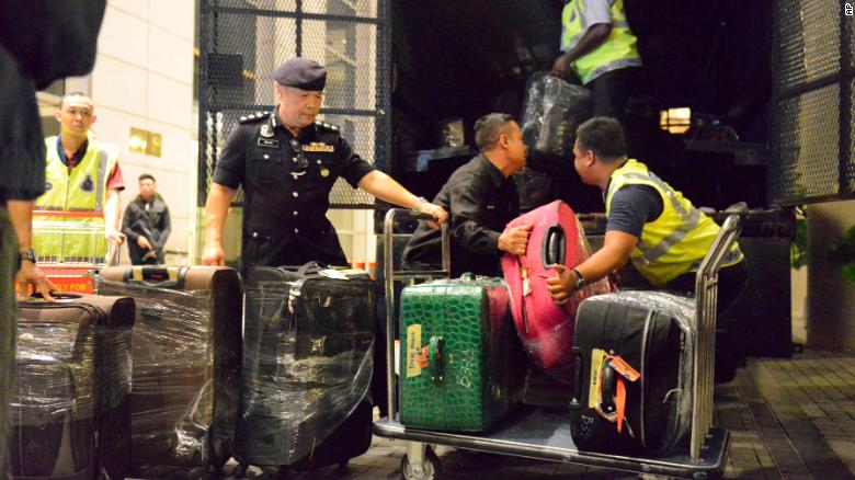 Malaysian police confiscated a few hundred designer handbags, cash, jewelry and other valuables as part of an investigation into former Prime Minister Najib Razak. 