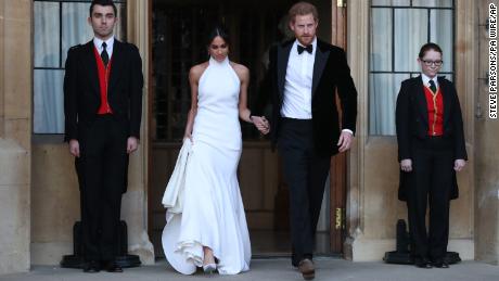 The newly married Duke and Duchess of Sussex, Meghan Markle and Prince Harry, leave Windsor Castle for an evening reception.
