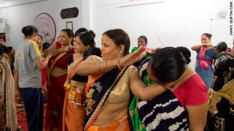Women learn how to incapacitate an attacker in New Delhi, India.