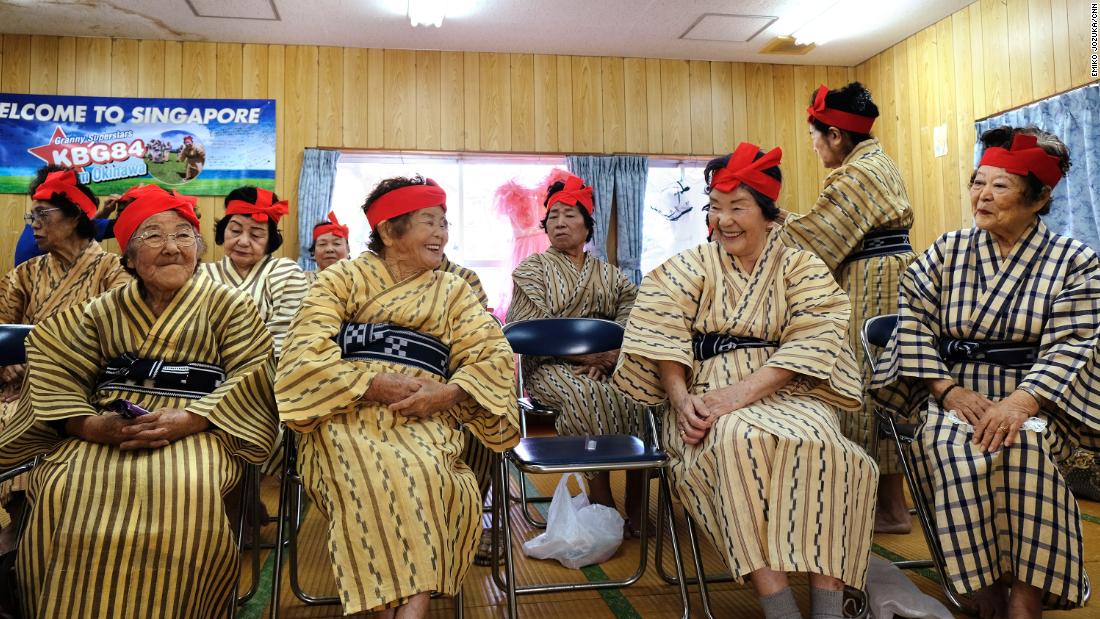 Members of KBG48 catch up before their monthly rehearsal. 
