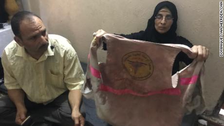 Ashraf and Sabreen al-Najjar display their daughter&#39;s bloodied medical vest.