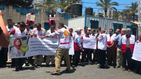 Palestinian medical workers protest outside a UN office in Gaza City.