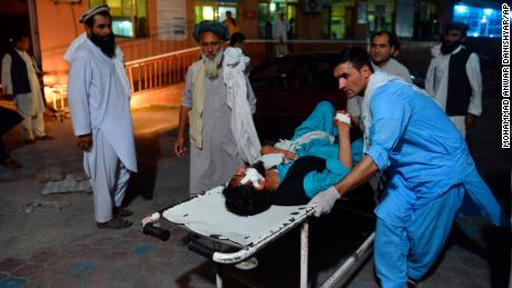   A wounded man is brought by a stretcher on June 16th to a hospital in Jalalabad, in Afghanistan. 