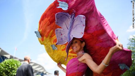 ASCOT, ENGLAND - JUNE 21:  A racegoer wears an outsize hat for Ladies Day during Royal Ascot Day 3 at Ascot Racecourse on June 21, 2018 in Ascot, United Kingdom. Royal Ascot is Britain&#39;s most valuable race meeting, attracting many of the world&#39;s finest racehorses to compete for more than £7.3m in prize money.  (Photo by Leon Neal/Getty Images)