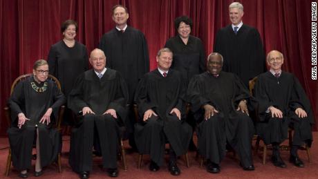 Justices of the US Supreme Court sit for their official group photo at the Supreme Court in Washington, DC, on June 1, 2017. 
Seated (L-R): Associate Justices Ruth Bader Ginsburg and Anthony M. Kennedy, Chief Justice of the US John G. Roberts, Associate Justices Clarence Thomas and Stephen Breyer. Standing (L-R): Associate Justices Elena Kagan, Samuel Alito Jr., Sonia Sotomayor and Neil Gorsuch. / AFP PHOTO / SAUL LOEB        (Photo credit should read SAUL LOEB/AFP/Getty Images)