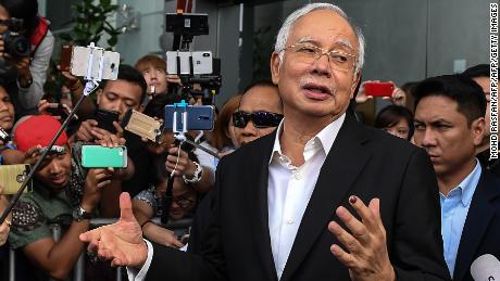 Najib has been banned from leaving the country as police investigate the 1MDB scandal.