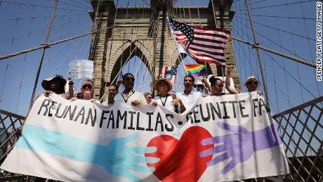   Thousands of people cross the Brooklyn Bridge in New York 