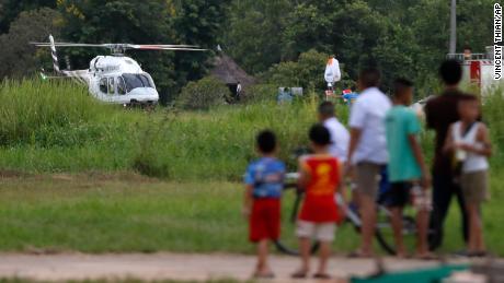 A helicopter believed to be carrying one of the boys rescued from the flooded caves.