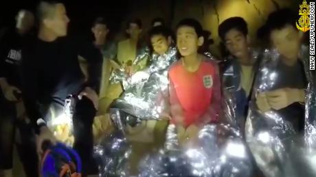 Members of the Royal Thai Navy are pictured with the 12 schoolboys, members of a local soccer team, and their coach, who were trapped in the Tham Luang Cave network in Northern Thailand.