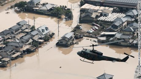 A residential area is seen on July 9 in Kurashiki, Okayama Prefecture, submerged following torrential rains that hit a wide area of western Japan.