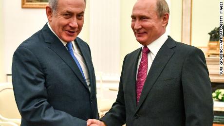   Russian President Vladimir Putin (R) shakes hands with Netanyahu during their meeting at the Kremlin in Moscow on July 11. Russian President Vladimir Putin shakes hands with Netanyahu during their meeting at the Kremlin in Moscow on July 11. 
