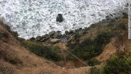   Emergency personnel used ropes to pull Angela Hernandez from the bottom of the cliff 