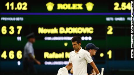 Novak Djokovic took the crucial third set versus Rafael Nadal before play was called for the evening due to Wimbledon&#39;s 11 p.m. local time curfew Friday. 