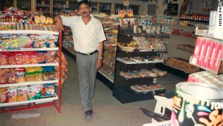   Hasmukh Patel, who was killed in 2004, stands inside his food store. 