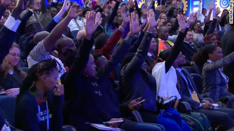 The enthusiastic crowd raises their hands in a bid to ask Obama a question on Wednesday. 