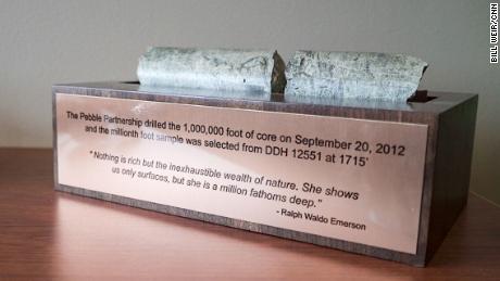 A core sample from the proposed Pebble Mine is mounted in the company offices above a quote from Ralph Waldo Emerson, a defender of the natural world.