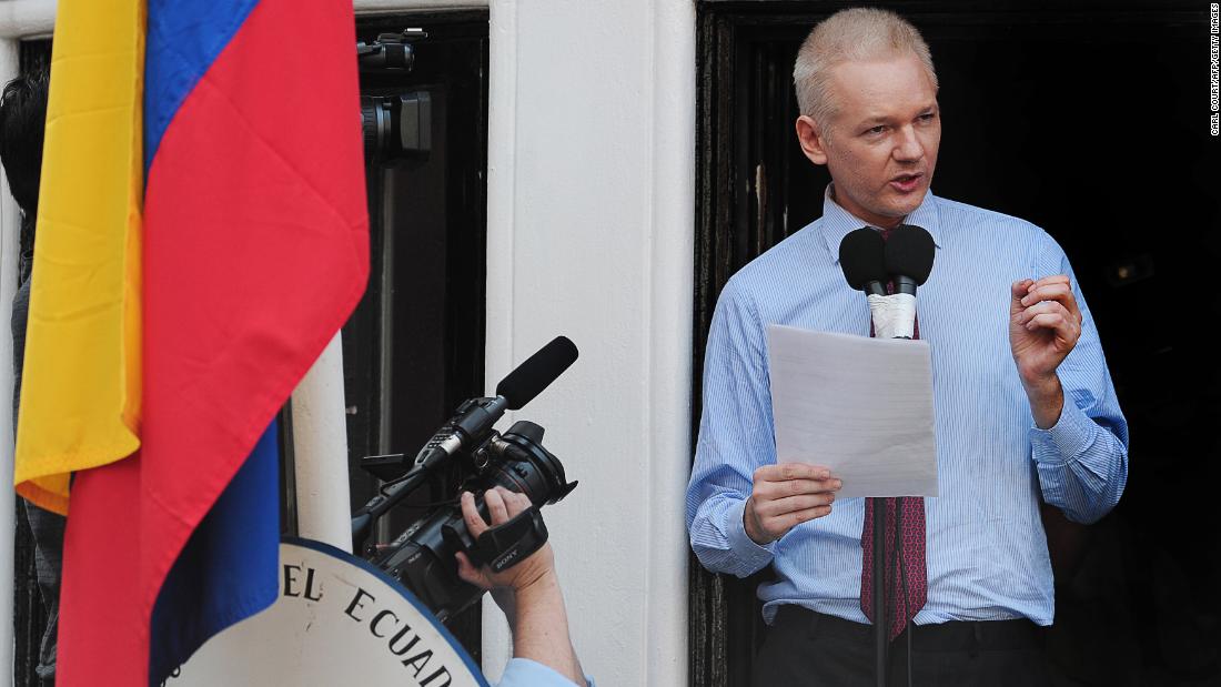 Assange addresses the media and his supporters from the balcony of the Ecuadorian Embassy in London on August 19, 2012. A few days earlier, Ecuador announced that it had granted asylum to Assange. In his public address, Assange demanded that the United States drop its &quot;witch hunt&quot; against WikiLeaks.